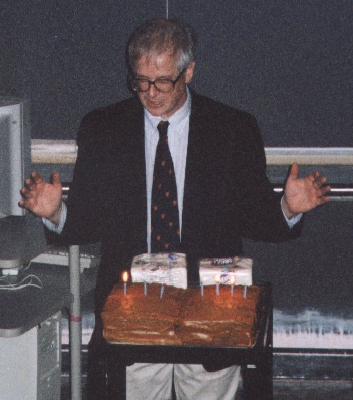 Dave Latham presenting the celebratory birthday cake at the Science Center